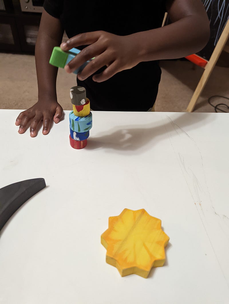 A child playing with space-themed toys