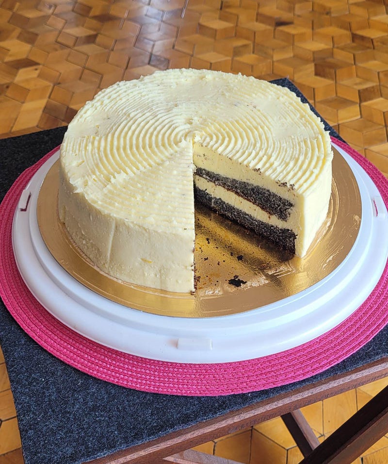 A slice of poppy seed cake with lemon cream